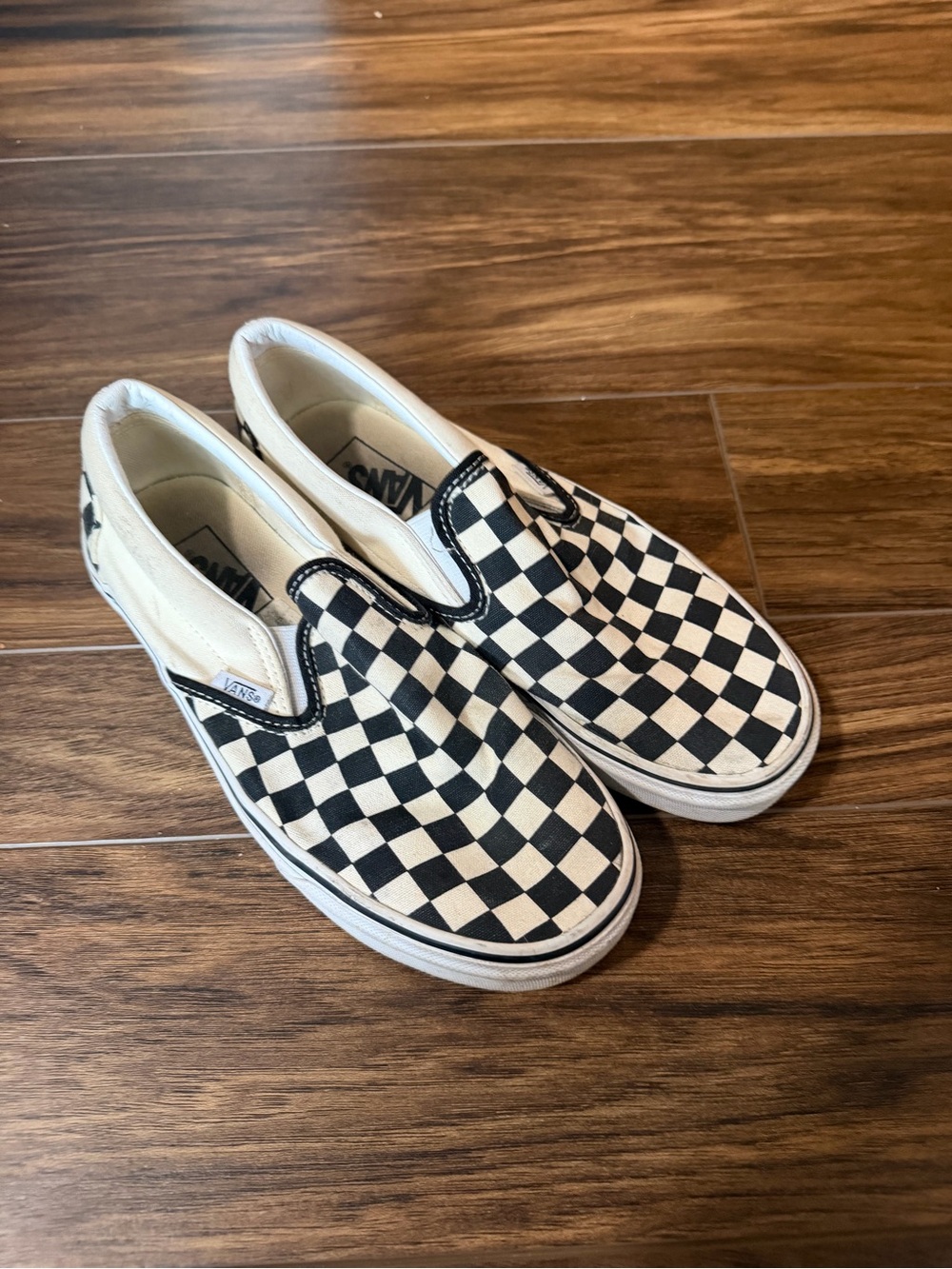 Vans Checkerboard Slip-On Sneakers in Black and White
